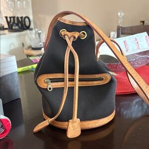 Dooney & Bourke Black Canvas Crossbody Bucket Bag with Tan Leather Trim